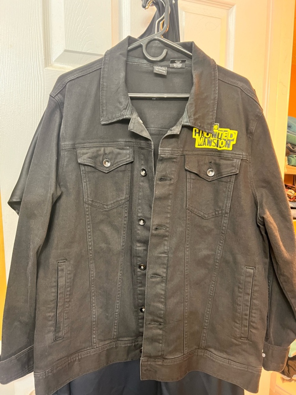 Disney Black Denim Jacket with Yellow Haunted Mansion Patch